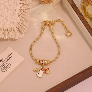 Detail of 18K gold tulip cat charm bracelet with snake chain and heart-shaped clasp