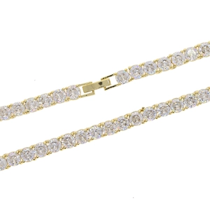 Detail of 5mm gold tennis chain with round cubic zirconia and secure folding clasp