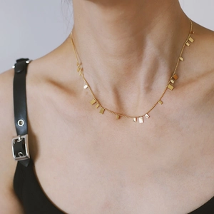 Elegant gold plated beaded chain necklace with geometric rectangular piano key pendants