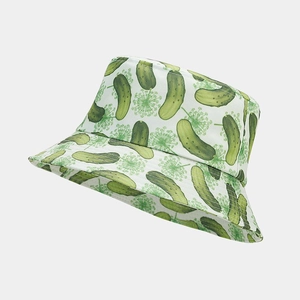 Detailed close-up of white cotton bucket hat with green cucumber and floral patterns