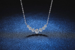Detail of s925 silver necklace featuring seven graduated round moissanite stones