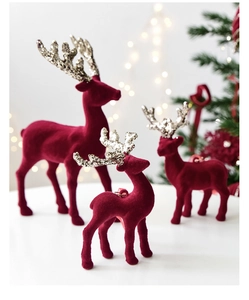 Detailed close-up of wine red flocked reindeer ornaments with silver glitter antlers
