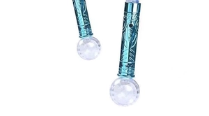 Close-up of the glowing blue metallic handle and transparent base of the snowflake magic wand