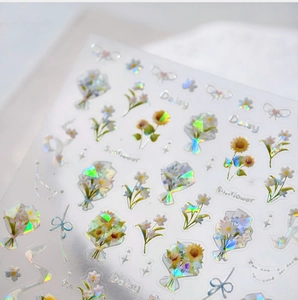 Macro view of floral 3D nail stickers with laser holographic finish and daisy patterns