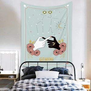 Detail of Gemini constellation wall tapestry in dusty green with floral and sun motifs