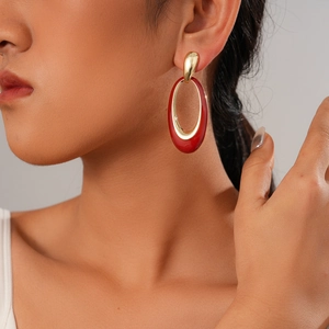 Minimalist six-piece gold drop oil heart earrings set worn by a model for elegant style