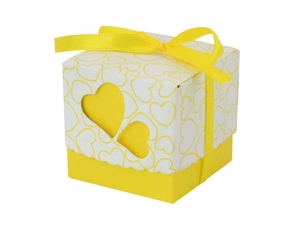 Detail of square wedding candy box with heart-shaped cutouts and yellow silk ribbon bow