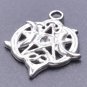 Macro detail of silver stainless steel star pendant with intricate Celtic knot design