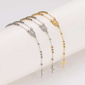 Three rosary bead necklaces in silver, gold, and bicolor with Madonna and cross pendants