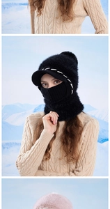 Close-up of black fleece winter hat with mask and scarf combo in snowy outdoors