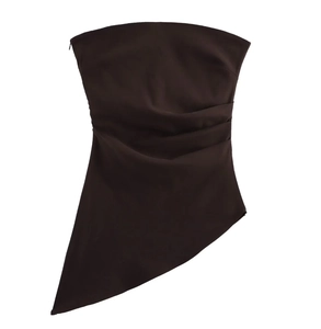 Detail view of dark brown strapless top with asymmetrical hem and side zipper