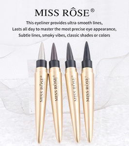 Set of four sleek gold-toned eyeliners in black, grey, brown, and white on mesh background