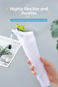 Close-up of flexible white mesh storage pouch with smooth zipper and nylon handle