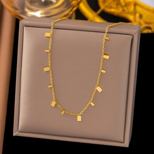 Elegant 18K gold-plated necklace with rectangular pendants on a luxury jewelry box display