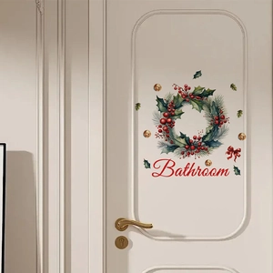 Weihnachtskranz Wandtattoo mit Badezimmer Schriftzug an einer weißen Zimmertür