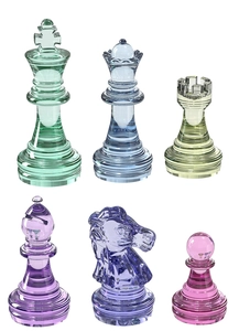 Macro view of crystal resin chess pieces in vibrant colors on a clean white background