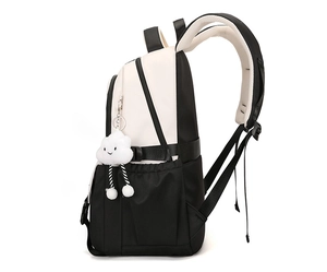 Detail view of large capacity backpack layers with soft cloud charm and mesh straps