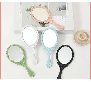 Baroque style handheld cosmetic mirrors in five pastel colors on a clean white background