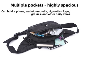 Flat lay of black nylon waist bag with multiple zipper pockets showing storage capacity