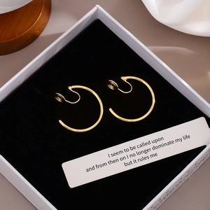 Minimalist vintage gold hoop earrings for non-pierced ears on elegant jewelry box