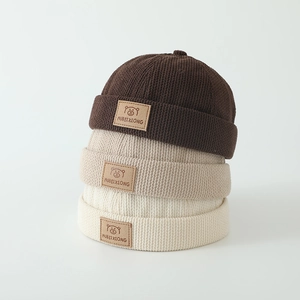 Winter waffle knit skullcaps for kids with bear patches in brown, beige, and khaki