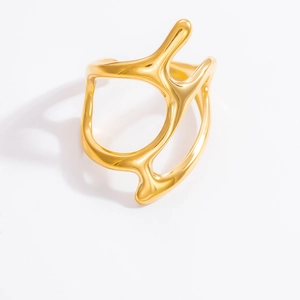 Detailed top view of a gold stainless steel irregular fluid line open ring on white backdrop