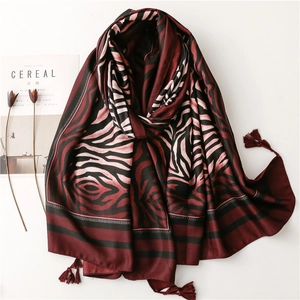 Summer beach shawl with zebra pattern and tassels in burgundy and black tones
