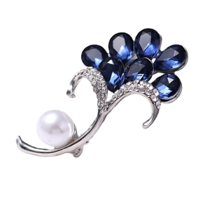 Exquisite silver alloy brooch featuring navy blue teardrop crystals and a large white pearl