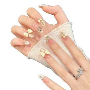 Handmade 3D piggy press-on nails with nude pink gradient, bows, and pearls