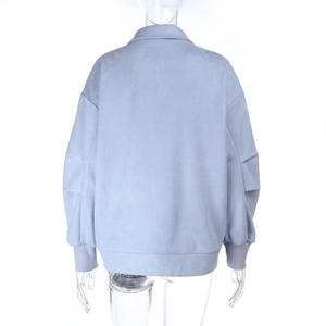 Detail view of the light blue faux suede jacket back with ribbed cuffs and hemline