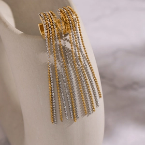 Elegant two-tone gold and silver beaded tassel hoop earrings with metallic fringe drops