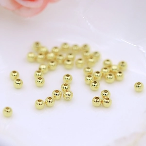 Macro shot of 18K gold plated smooth spacer beads for DIY jewelry making