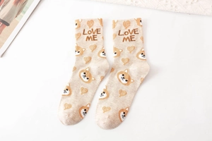 Detailed close-up of beige cotton socks with Shiba Inu patterns and LOVE ME text