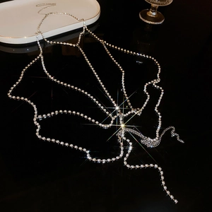 Detail of silver multilayer rhinestone body chain with starburst light effect