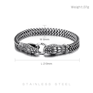 Detail of 8mm wide stainless steel chain bracelet with double snake heads for men