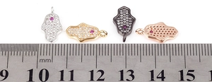 Detailed size comparison of Hamsa Hand micro pendants in four metallic finishes