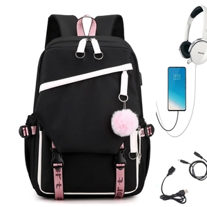 Minimalist black and pink nylon backpack with USB port and plush charm on white background