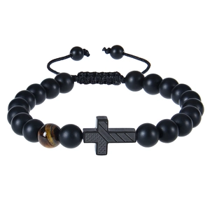 Close-up of matte black beads bracelet with tiger eye stone and cross pendant