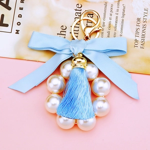 Blue satin bow keychain with white pearls and gold metal tassel for car keys and bags