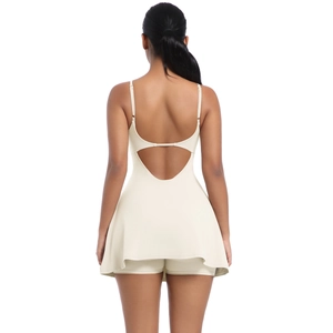 Detail of cross-back design on a cream sports tennis dress with breathable fabric