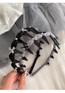 Detail of rhinestone bow hair comb headband in black and grey elegant lace fabric