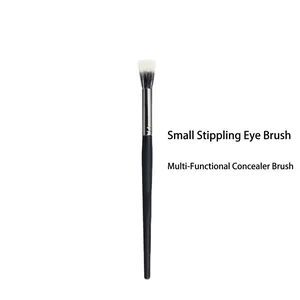 Detail of small stippling eye brush and concealer brush with soft synthetic bristles