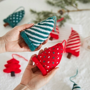 Knitted Christmas tree hanging ornaments in red, green and white festive colors