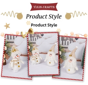Detailed views of festive Christmas gnome dolls with ivory plush fabric and golden glitter