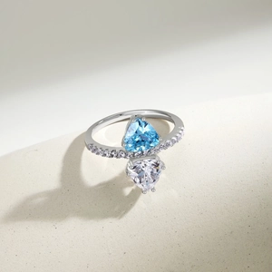Macro detail of S925 silver ring featuring blue and white triangle cut zircon stones