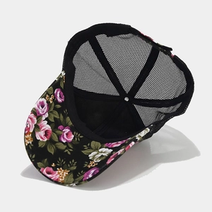 Inside view of floral print baseball cap with black mesh back and cotton brim