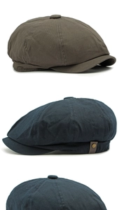 Detail of vintage newsboy caps featuring cotton fabric textures and metal side buckles