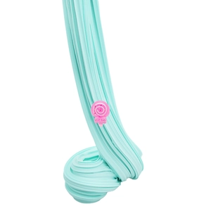 Texture detail of stretchy light blue butter slime with a small pink candy charm
