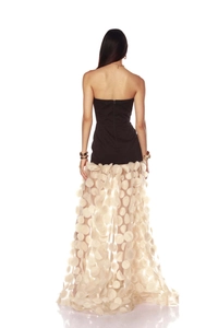 Back view of elegant black tube top dress with white polka dot mesh skirt and zipper detail