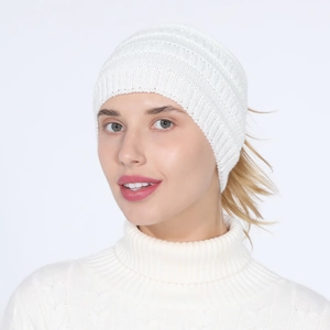 Close-up of white knitted ponytail headband showing fine winter wool texture and detail